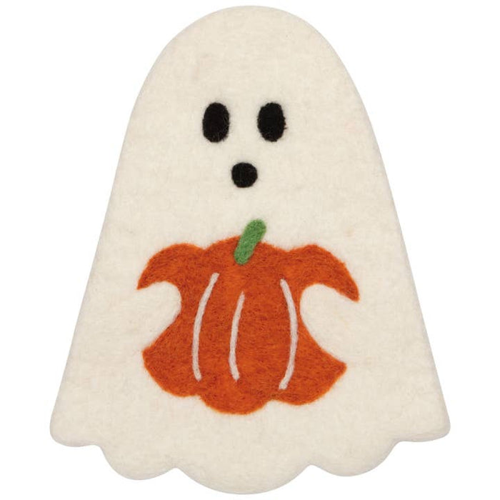 Ghost shaped trivet holding a pumpkin