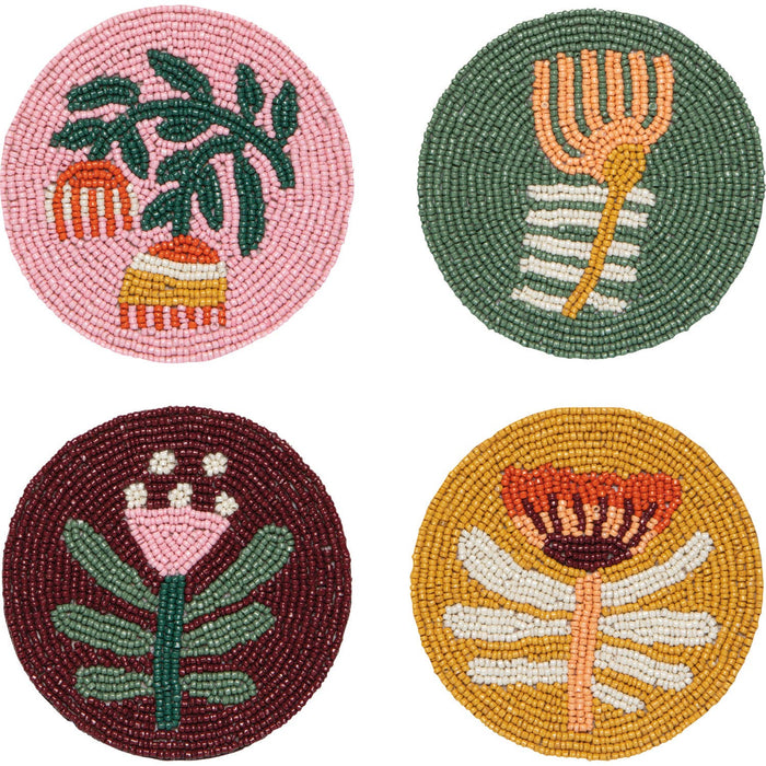 Set of four beaded coasters with botanical designs